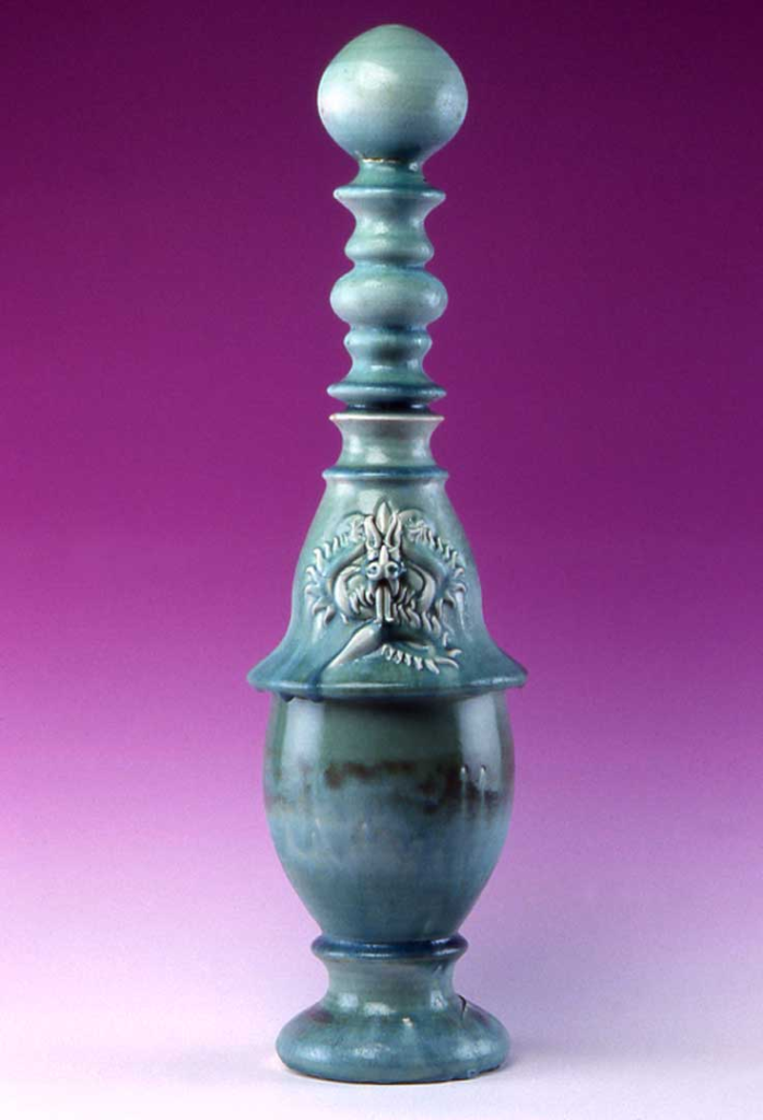 “Porcelain Tatsu dragon vessel, wheel thrown, handcrafted mythical creature art”