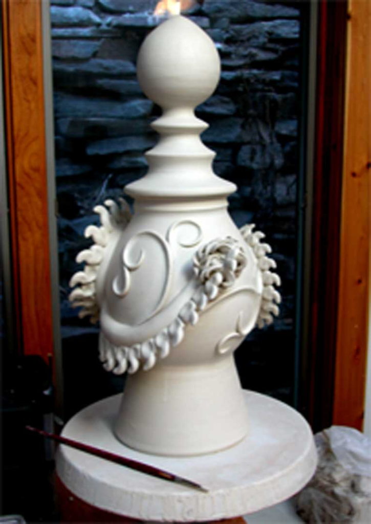 “Porcelain Tatsu dragon funeral urn in greenware state, wheel‑thrown pottery with hand‑sculpted dragon effigy, artisan ceramic art”