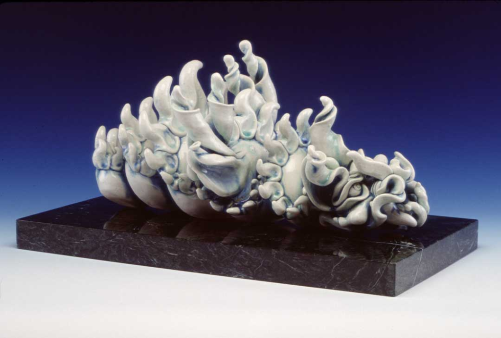 Yinglong porcelain dragon sculpture carved from solid porcelain, high‑fired in iron‑green blue oxidation glaze, mounted on Vermont Verde marble base.