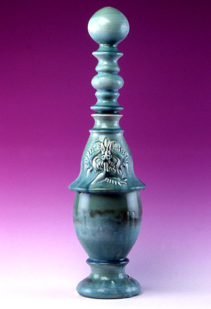 Porcelain Tatsu dragon vessel, wheel‑thrown and carved in relief with celadon‑style glaze.