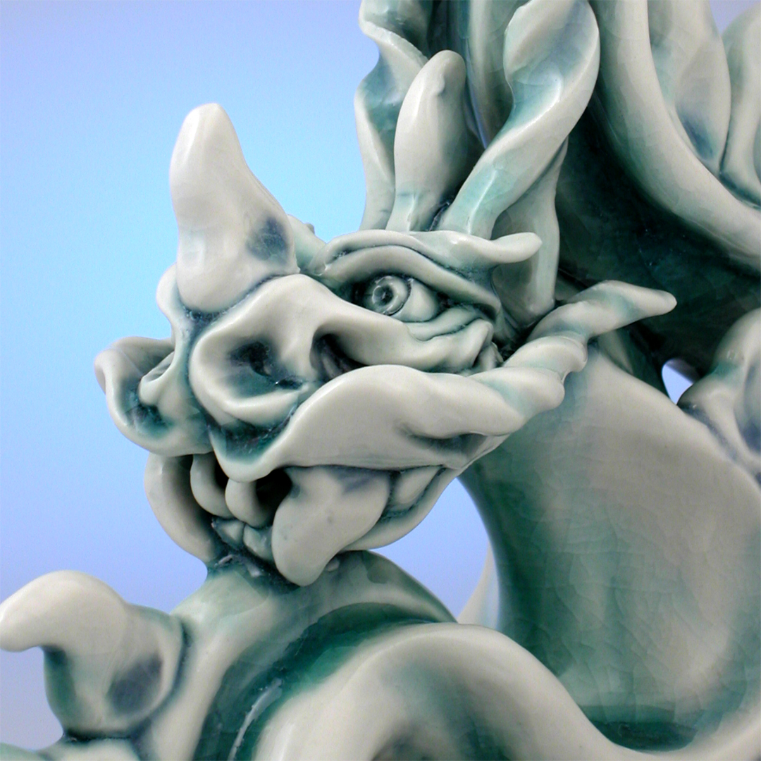 Porcelain Tatsu dragon sculpture, side-of-face detail.