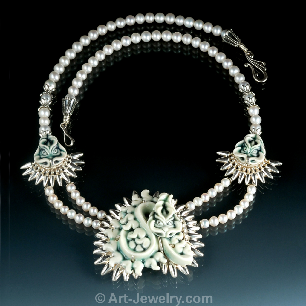 Hand‑carved porcelain coiled dragon talisman in a custom sterling silver bezel with white pearls, one‑of‑a‑kind fine art dragon necklace